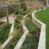 Mutliple levels of stonework terraces are home to a wide range of plant species for year round colour